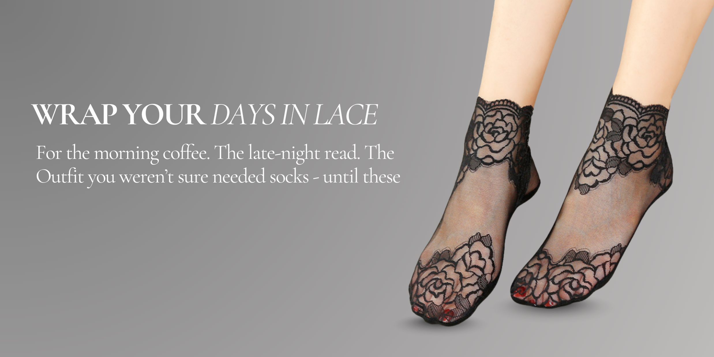 Model wearing sheer black lace ankle socks with floral embroidery, styled against a soft grey background.
