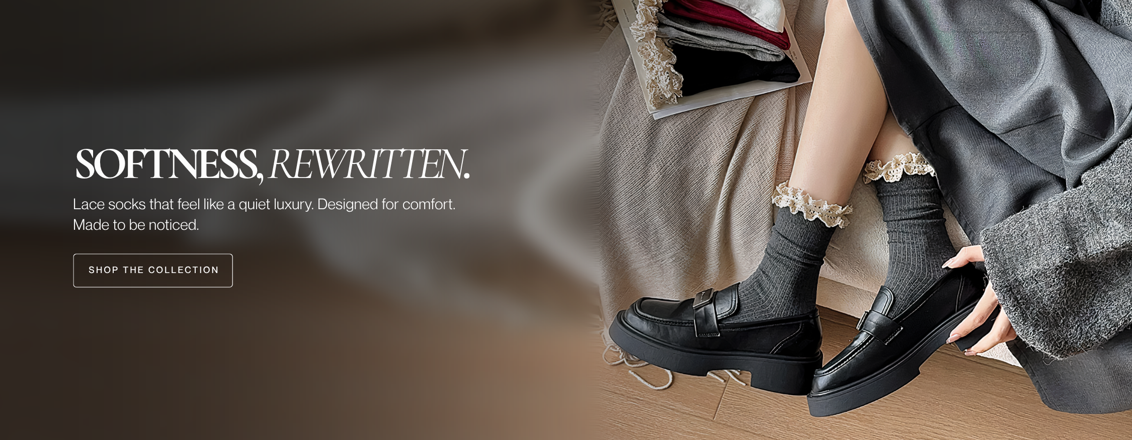 Person wearing black shoes and gray socks with a soft focus background