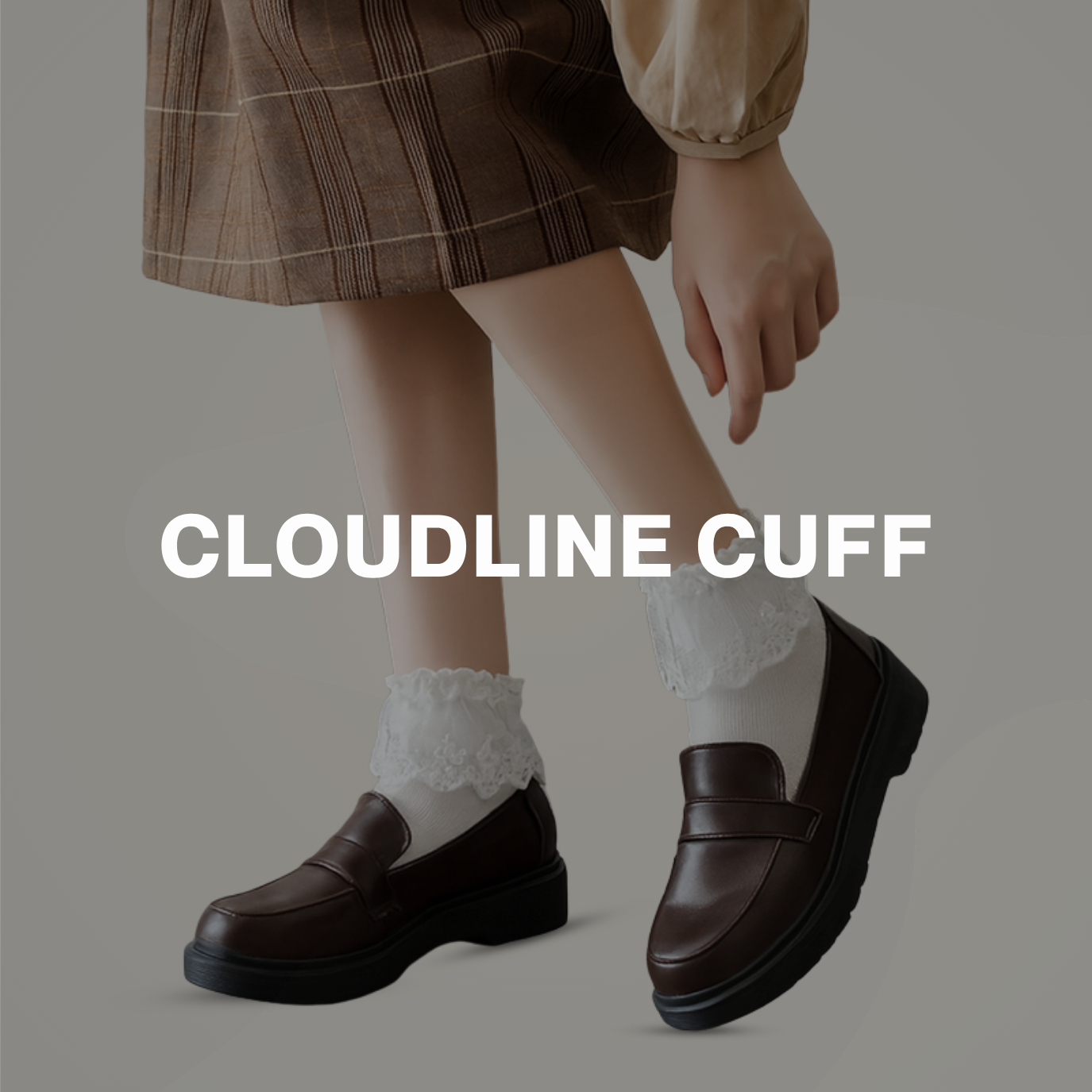 Model wearing white lace cuff socks with brown loafers and a plaid skirt, styled for a soft vintage look.